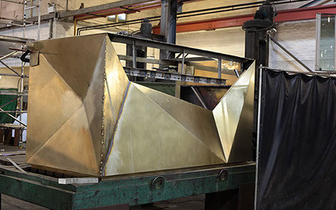Folded and welded bronze fabrication